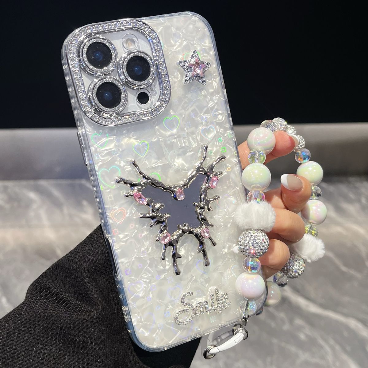 闪钻镭射贝壳纹蝴蝶镜子iPhone1716手机壳适用苹果1413promaxIMD壳tpu软边12链条挂绳11高级感小众日韩ins风新款-精孔贝壳-蝴蝶镜子-白色-手链 iphone 17 Pro 